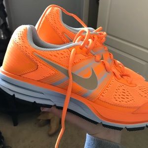 Neon orange Nike shoes
